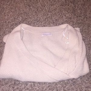 A low shoulder sweater